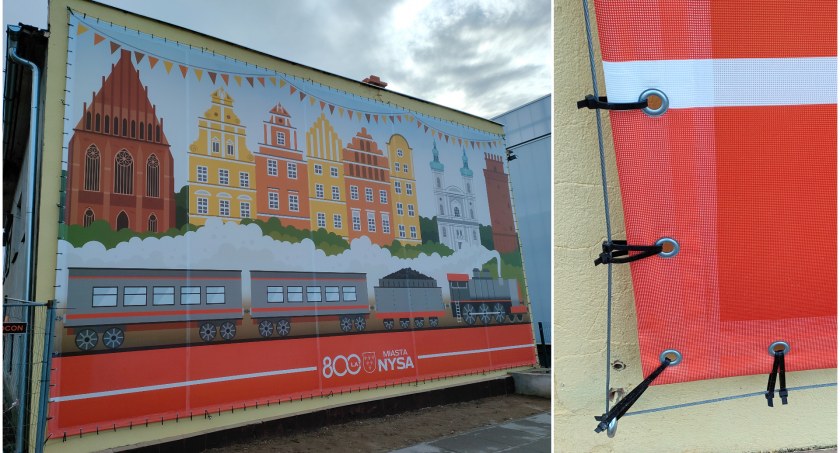 Po co wydawać pieniądze na mural, kiedy można zamontować baner oczkowy i przymocować go na trytytkach 